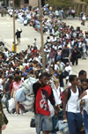 National Guardsmen divide the long line into two, allowing the back of the line up the ramp as residents try to find refuge in the Superdome from Hurricane Katrina. August 28, 2005 Ted Jackson