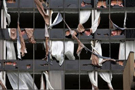 The North side of the Hyatt hotel in New Orleans was shredded by 140mph winds when Hurricane Katrina made landfall on the Louisiana coast on Monday, Aug. 29, 2005.(AP Photo/Dave Martin)