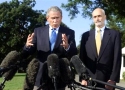 U.S. President George W. Bush (L) speaks before departing the White House to tour areas devastated by Hurricane Katrina, September 2, 2005. Relief efforts after Hurricane Katrina are 'not acceptable', Bush said Friday before heading out on a tour of storm-ravaged New Orleans and other areas of the U.S. Gulf Coast. Beside Bush is Homeland Security Secretary Michael Chertoff, who will accompany him on his tour. (Kevin Lamarque/Reuters) 