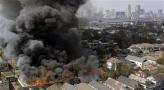 Buildings burn on the east side of New Orleans, LA., Saturday, Sept. 3, 2005.(AP Photo/Phil Coale)